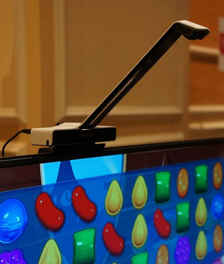 The Touchjet's magic happens at the end of its extensible arm which has optical sensors to recognize finger movement. The base has the Android control box, a camera and microphones.