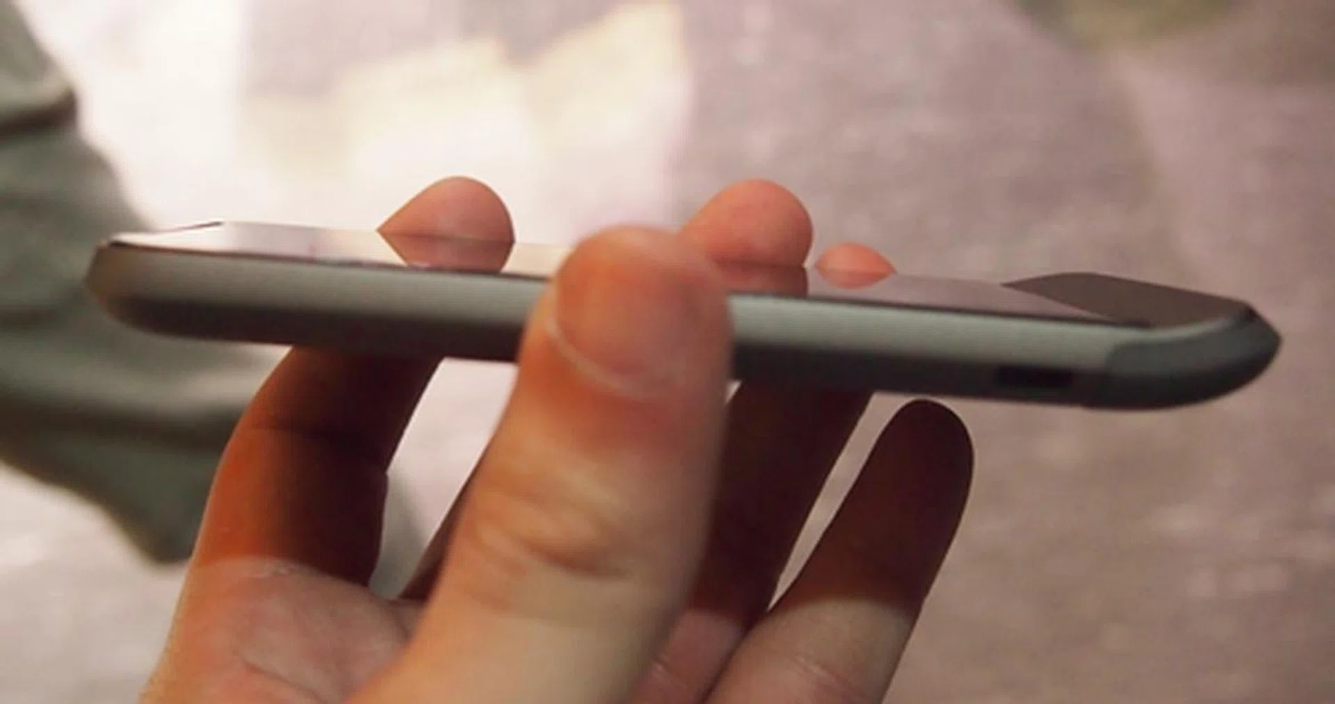 The curved chin guard remains a signature design of HTC's past devices such as the Hero and Legend. 