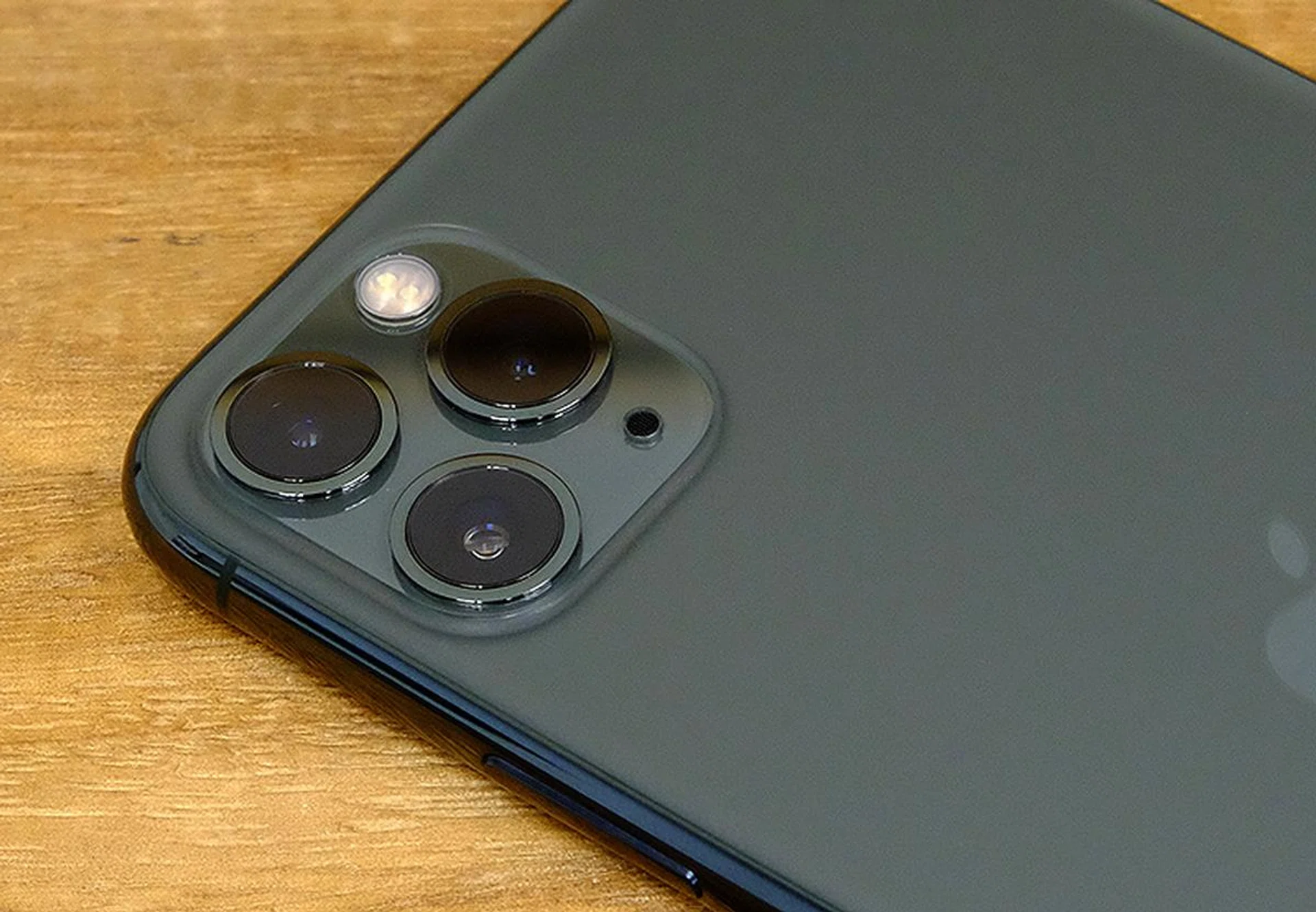 The camera bump is very conspicuous. The glass isn't an add-on but it's actually part of the glass back. The back of the phone is milled from a single piece of glass.