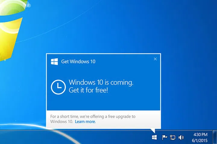Click on the small Windows icon found at the right end of the taskbar to begin reserving your free upgrade.