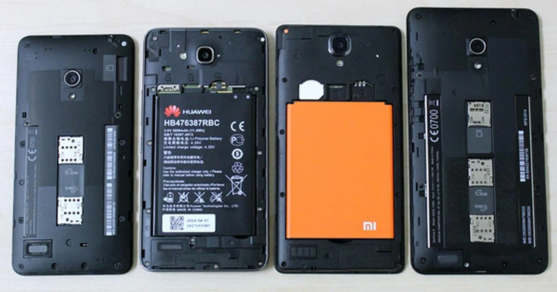 With their back covers removed, you can see that all the compared phones have dual SIM card support. From left to right: ASUS ZenFone 5, Huawei Honor 3X, Xiaomi Redmi Note and ASUS ZenFone 6.