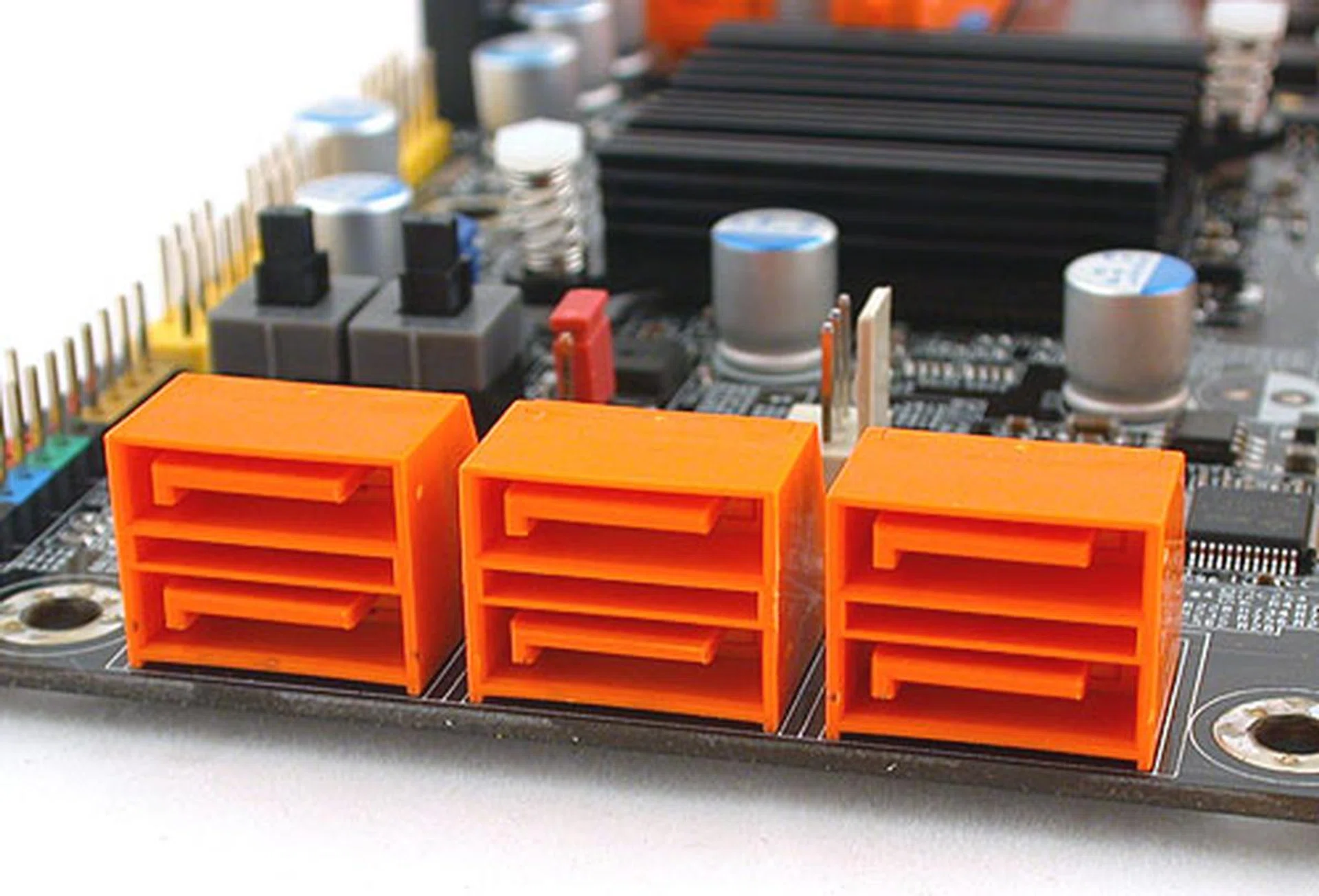 Six SATA 3.0Gbps ports are all you're going to find on this mATX board. DFI has not added any extra controllers to increase this number.