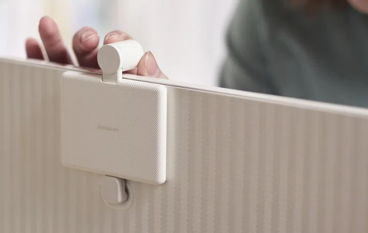 The camera is magnetic and also draws its power from the monitor. Image source: Samsung. 