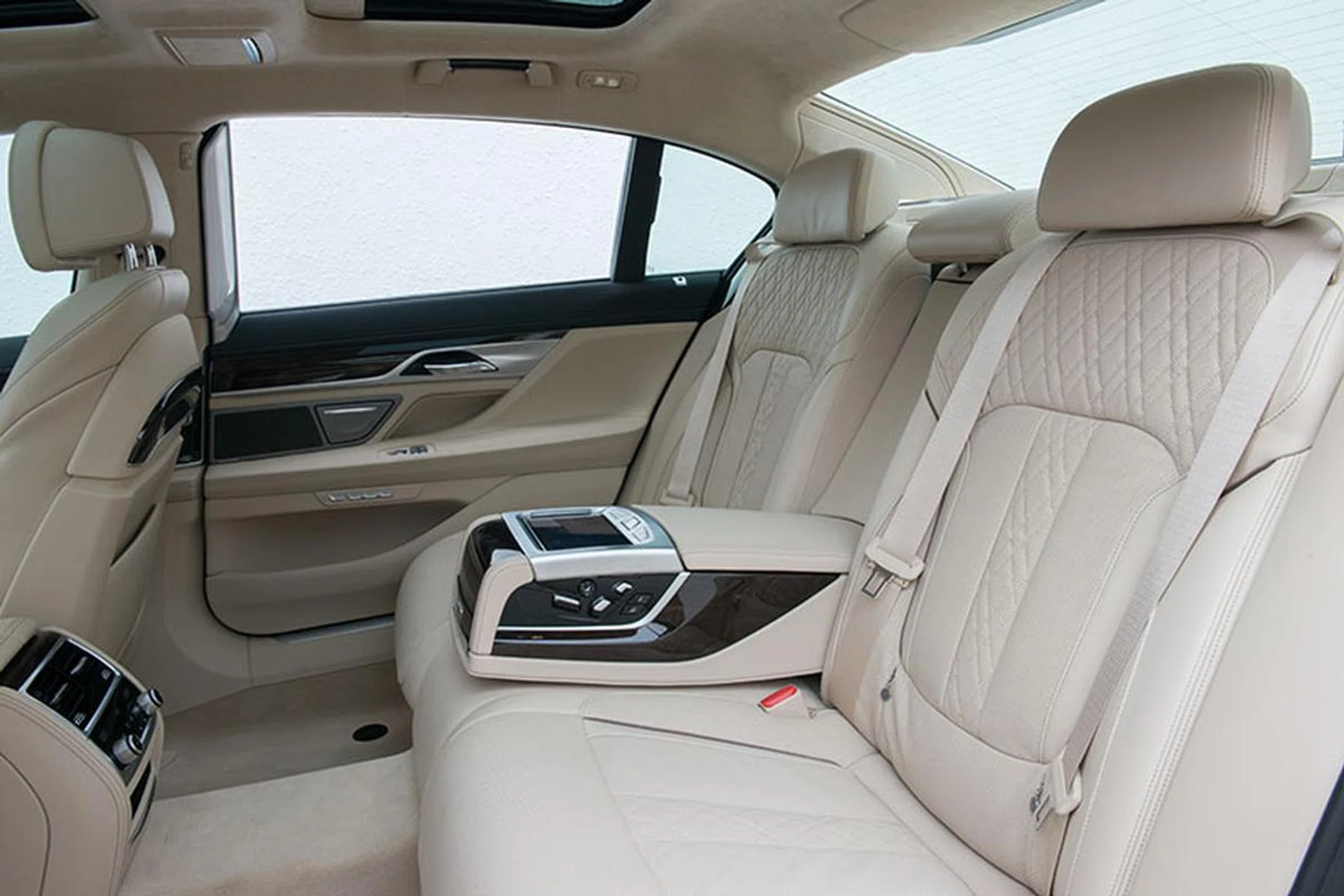 Passengers in the rear are enveloped in plush nappa leather, wood and aluminum trimmings. (Image source: BMW Asia)