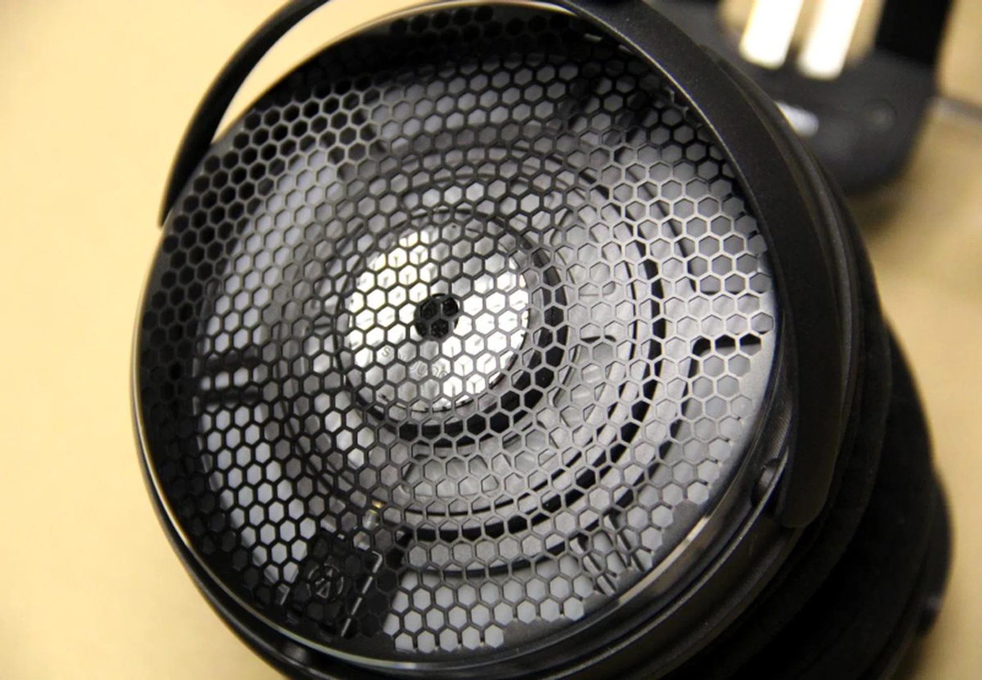 The ear cups and drivers are completely exposed and leaks a lot of sound, both in and out.