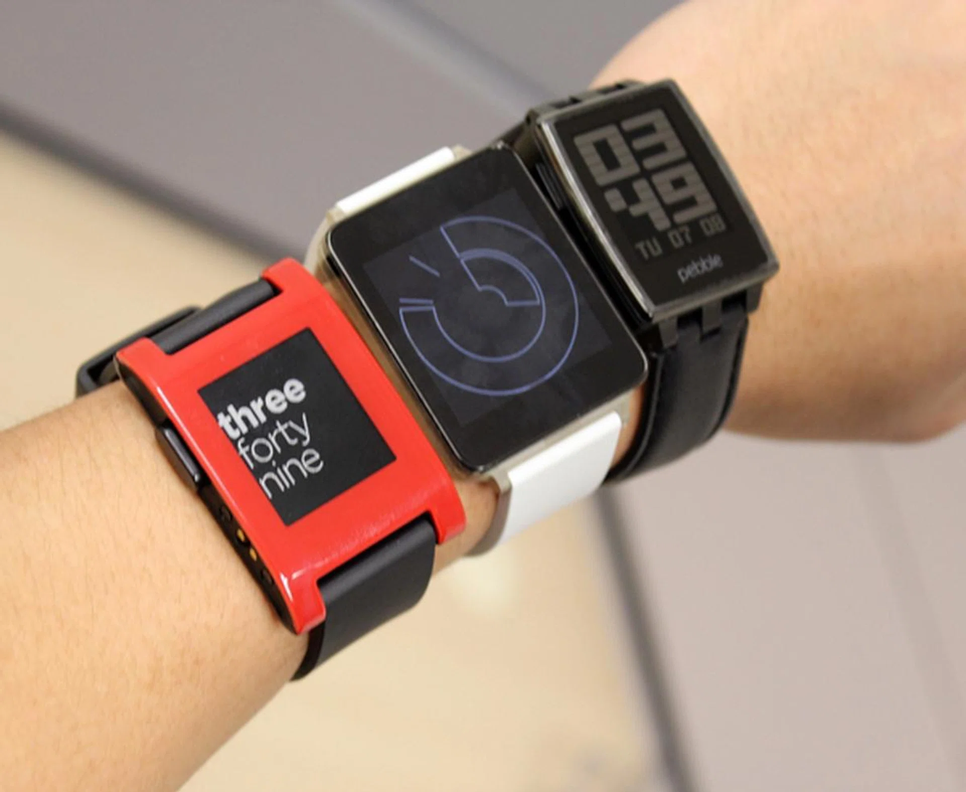 The three smartwatches (in the same exact order as above) on our wrist.
