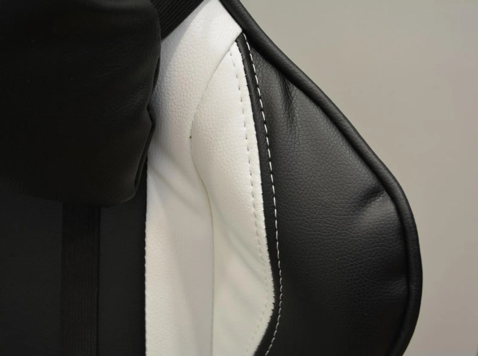 A close-up shot of the PU leather on the Throne, which also features white stitching that matches the color of the chair.