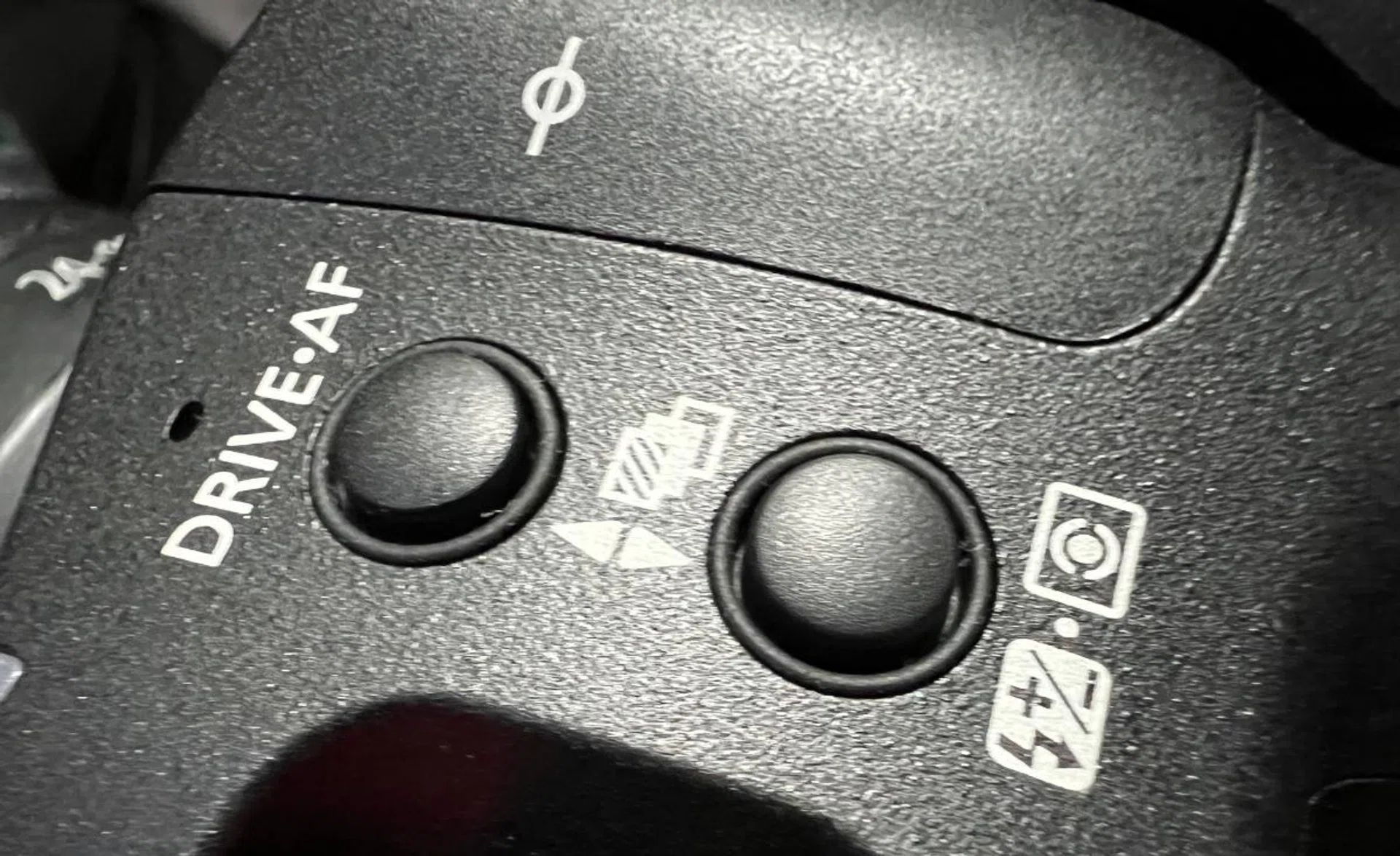 The Drive Mode and Flash exposure compensation buttons. Photo: HWZ