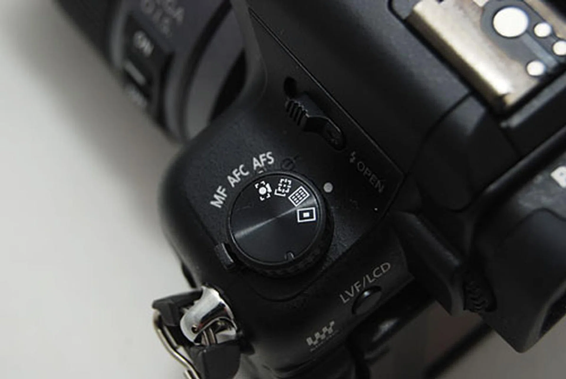 A auto-focus mode dial has been added on top of the focus mode lever. The GH2 gives you quick access to most manual settings.