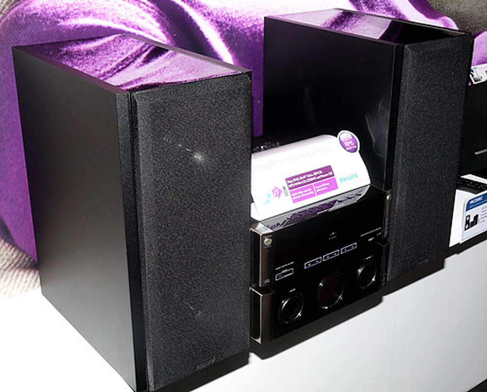 The MCD802 comes with a sizable pair of 5.25-inch woofers that dwarf the actual unit. Total output power is rated at 400W. Formats supported included DivX, DVD, VCD, MP3-CD, WMA-CD. There's also karaoke functionality. It's expected to retail at $499.