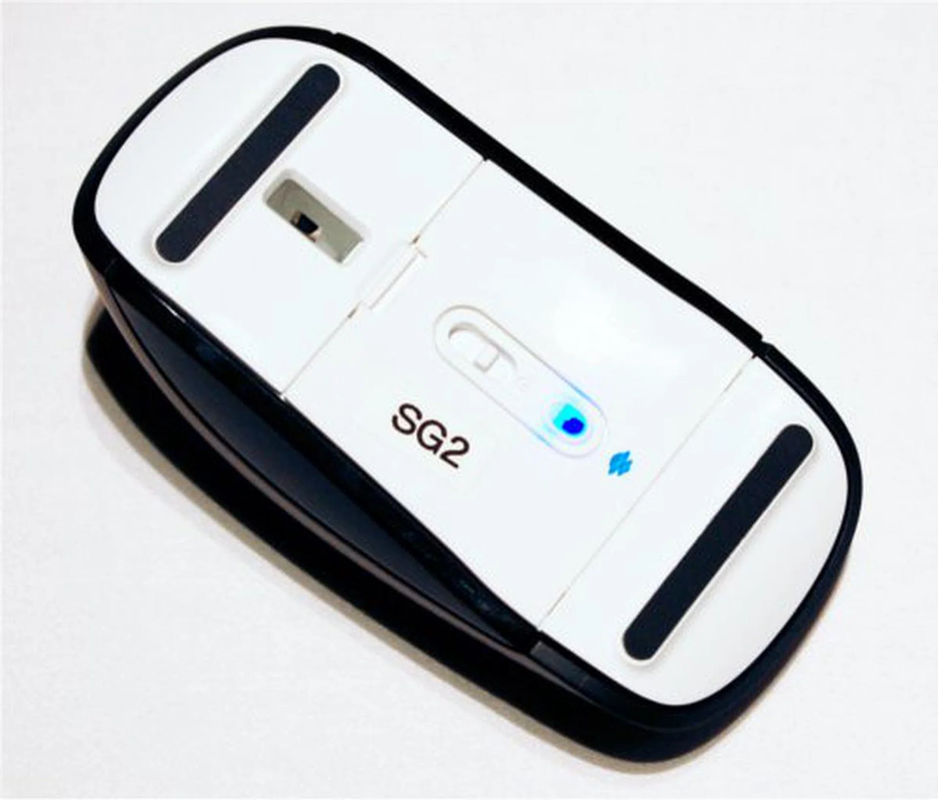 Flipping the Touch Mouse over reveals the power switch and evidence of Bluetrack technology.