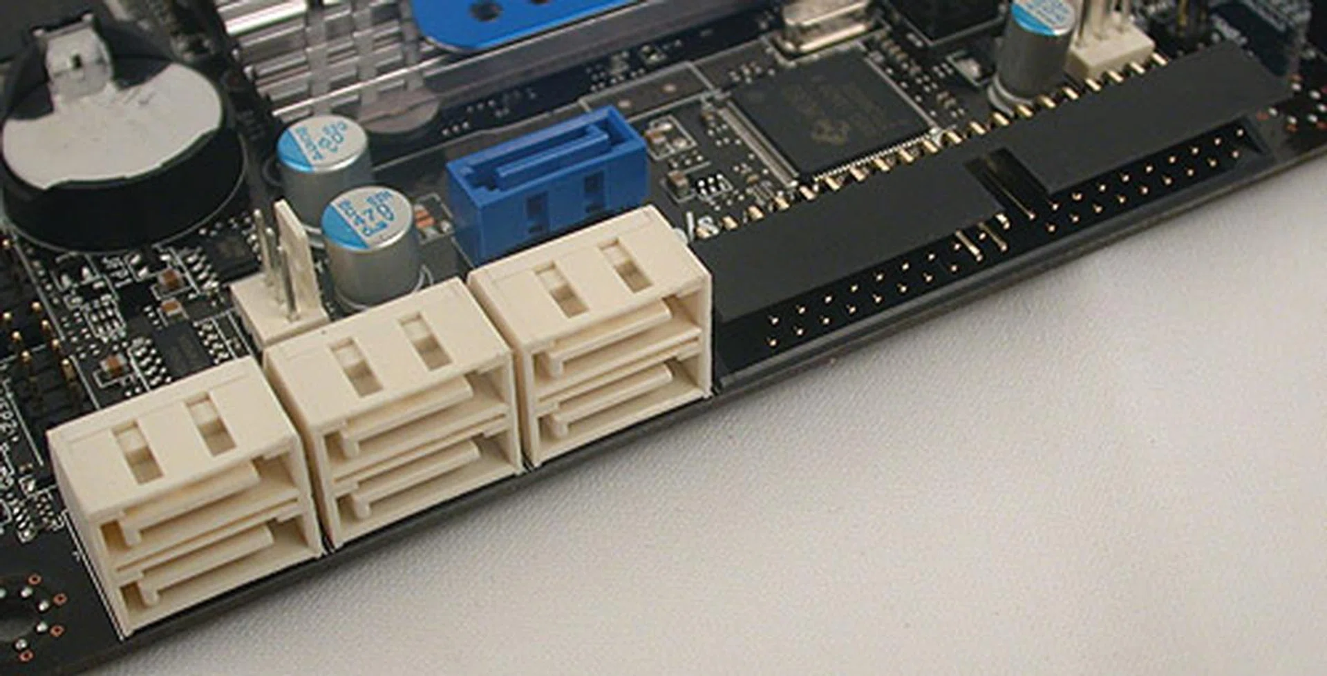 Six SATA 6Gbps ports aligned the way we like it, out of the way of add-on cards. There's also an IDE port as a nod to the old-timers. The blue SATA port just about avoids being affected if you have a couple of long dual-slot graphics cards installed.