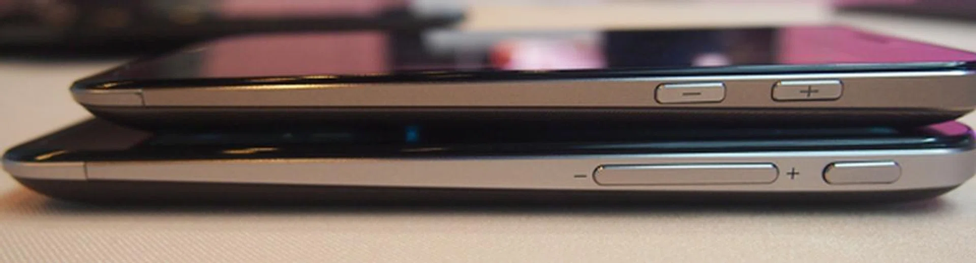 The Power button is shifted to the right side of the ASUS PadFone 2 (bottom). Buttons retain the same tactile feel, which makes them easy to feel. Both PadFones sport tapered designs.