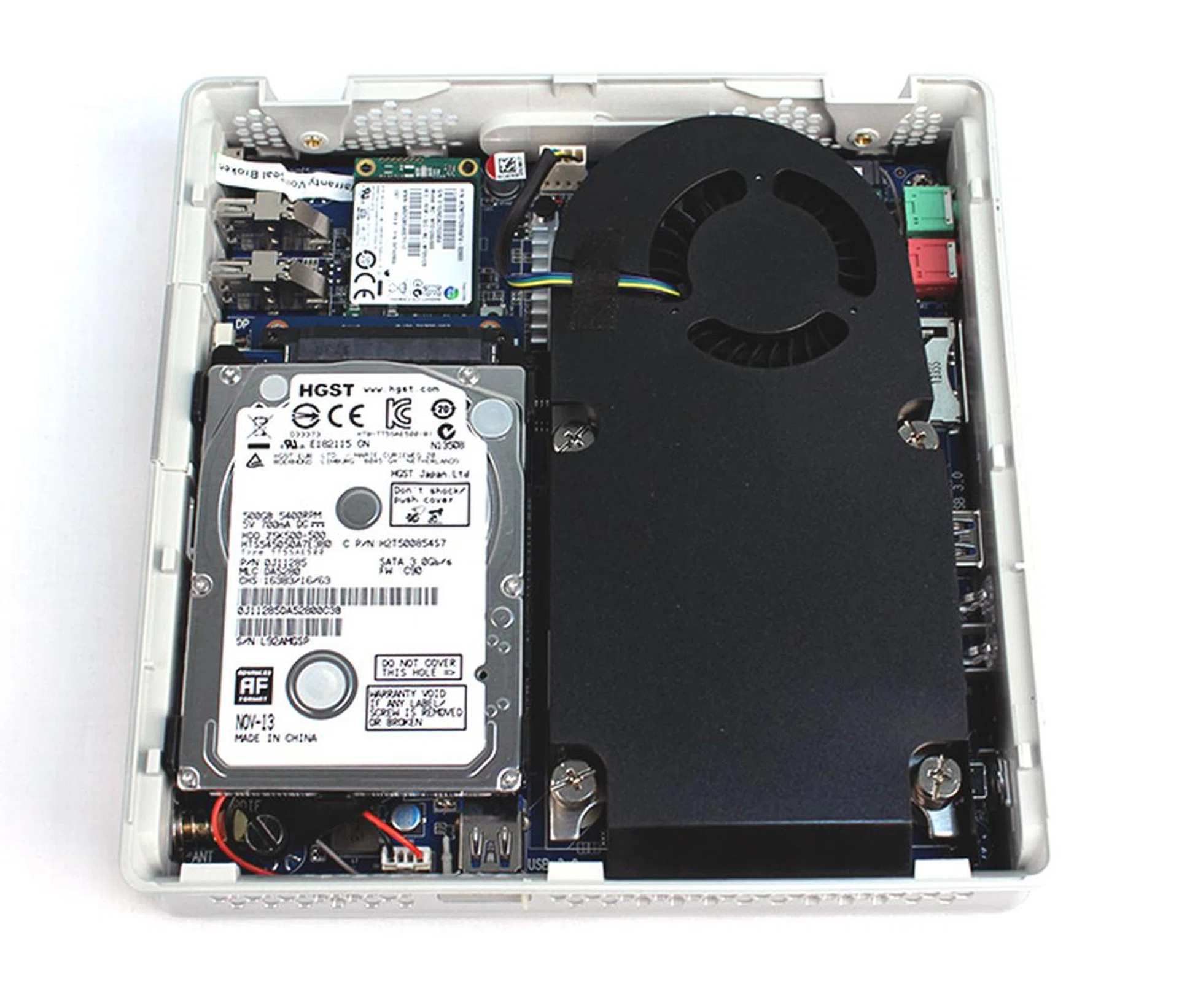 The Zotac ZBOX IQ01 with all the components installed. The memory SO-DIMM slots are under the 2.5-inch hard disk drive. As you can see, the cooler takes up bulk of the space. Fortunately, despite its size, it is pretty quiet.