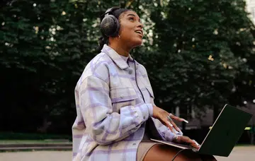 Beyerdynamic DT 900 Pro X on woman's head.