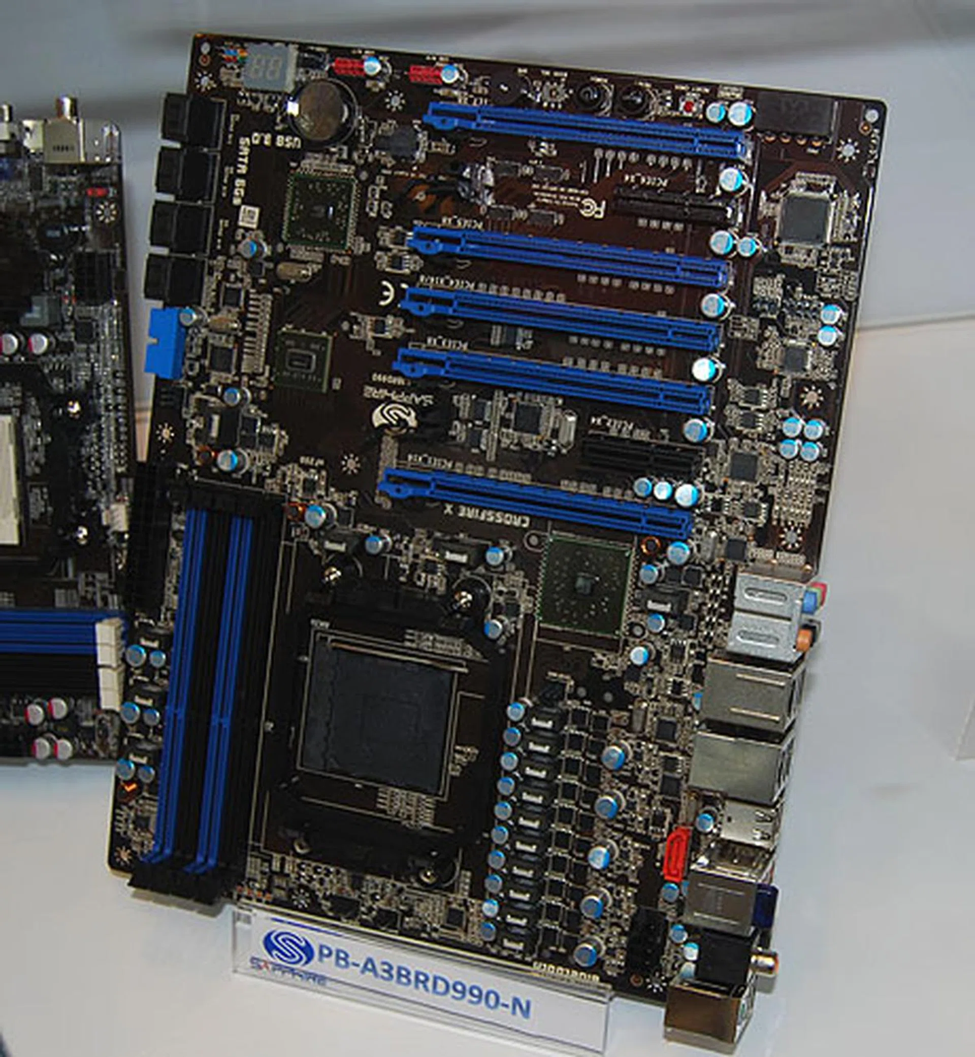 Sapphire's top AMD board is this Pure Black 990FX-N. It supports upcoming AMD processors and has five PCIe 2.0 x16 slots that support CrossFireX. It has dual Gigabit LAN ports, four USB 3.0 ports and two SATA 6Gbps ports. 