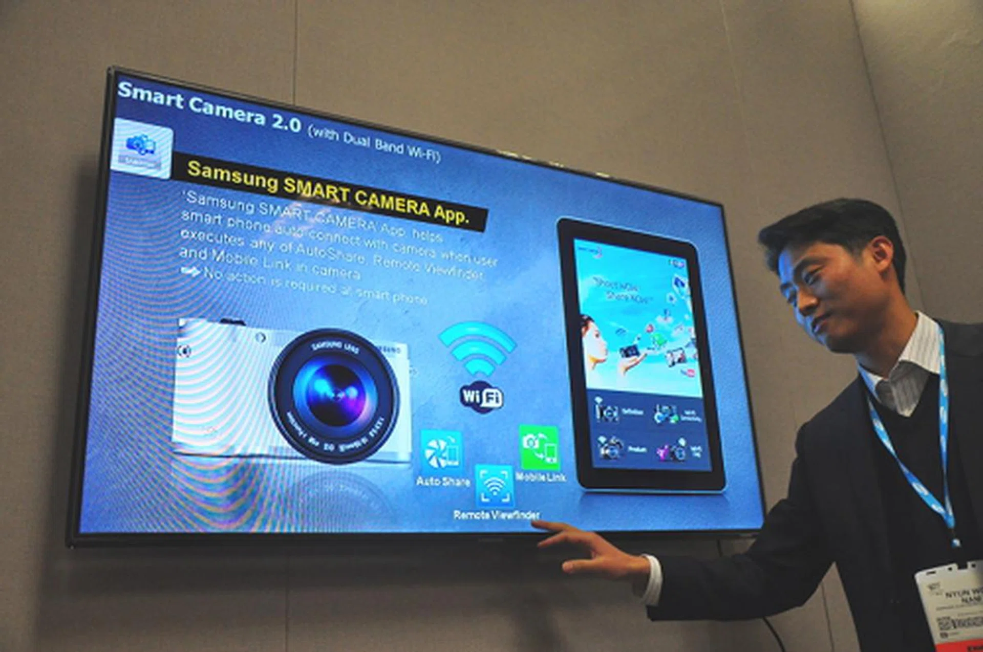 The Samsung Smart Camera app has been updated to combine three features - Auto Share, Mobile Link, Remote Viewfinder. Previously, both Mobile Link and Remote Viewfinder features were in two separate apps. Auto Share is a new feature that allows users to set your camera to auto send images to your mobile devices as they are being shot.