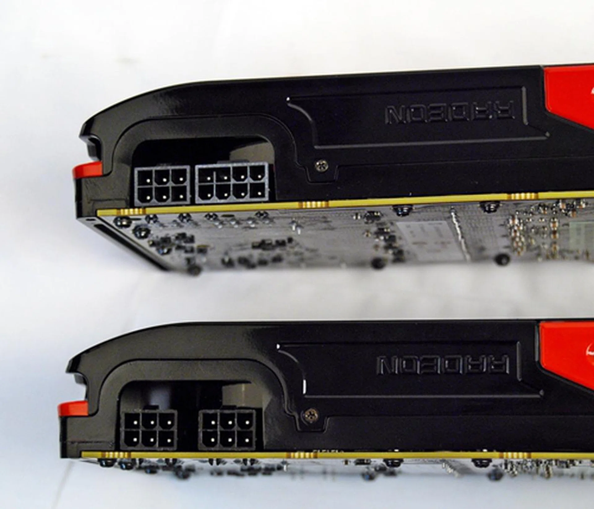 At the top, Radeon HD 7970 has one 6-pin PCIe power connector and an 8-pin one. Its younger brother, Radeon HD 7950, has a pair of 6-pin PCIe power connectors.