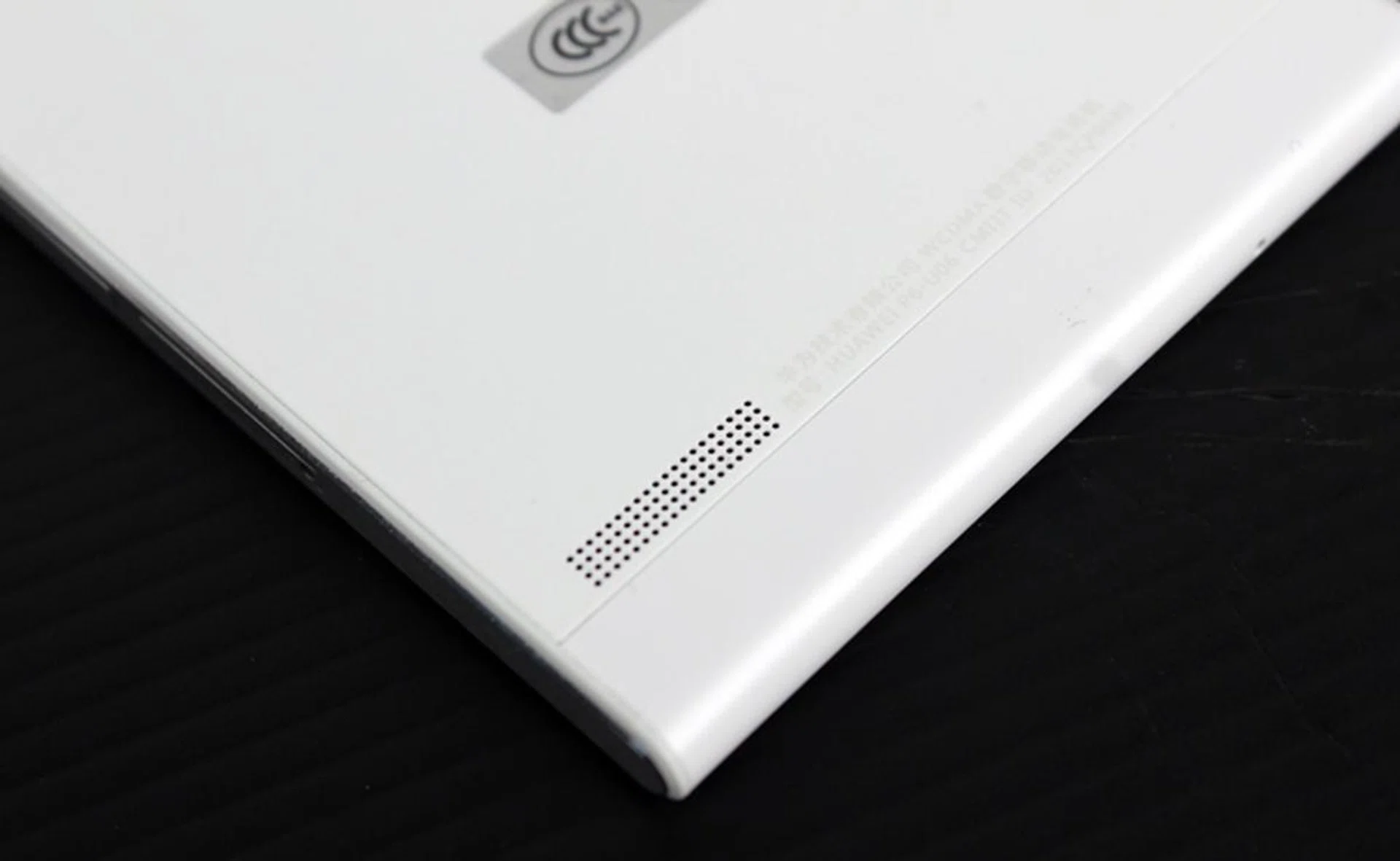 The P6's speaker is strangely located on the rear, projecting the sound away from you (or right into your palm).