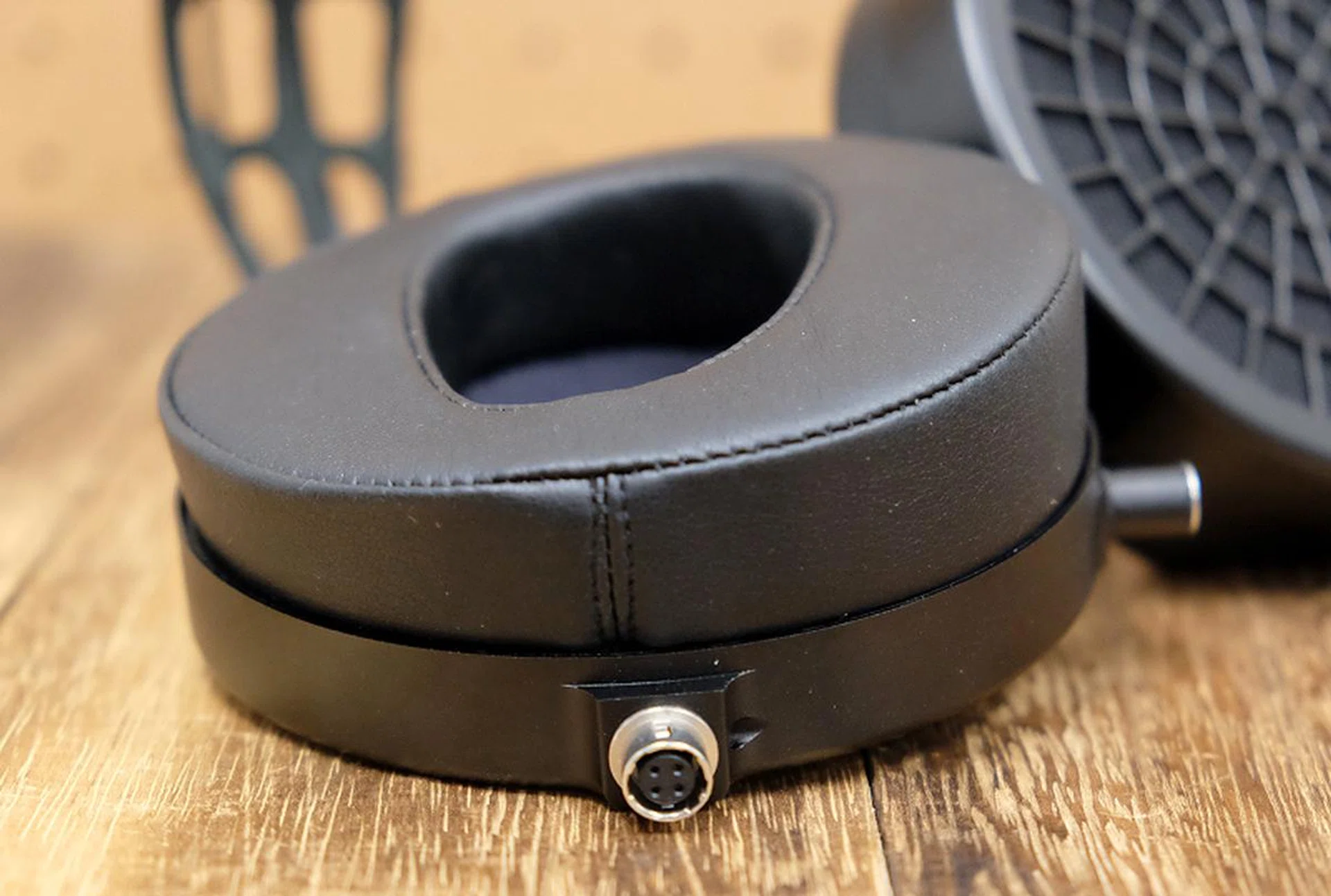 The ear pads are relatively thin and comparatively stiff.