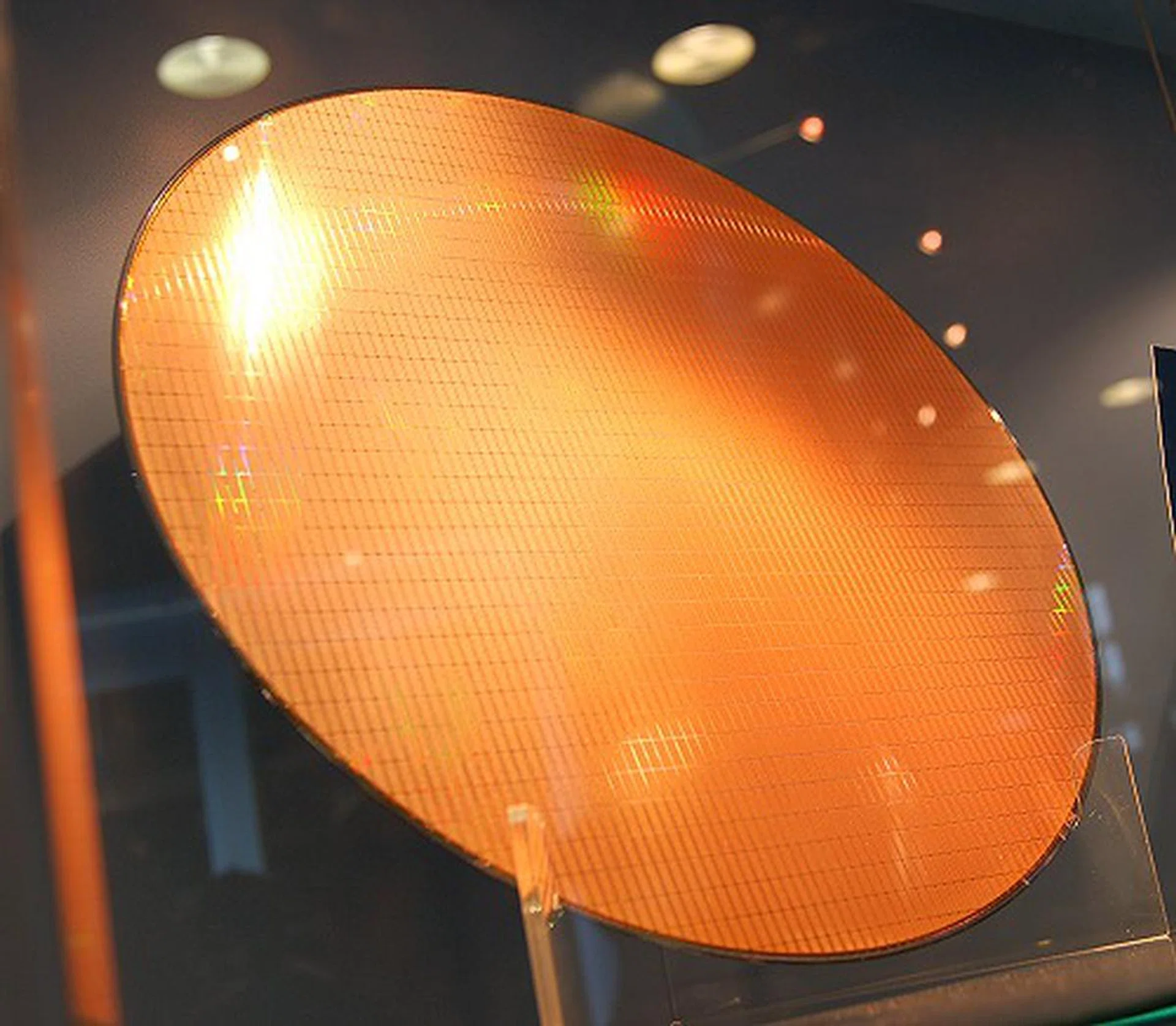  This is a silicon wafer of Atom processors that's powering the MID devices shown here. The Atom is so small that a single 300mm wafer yields about 2500 processors.  