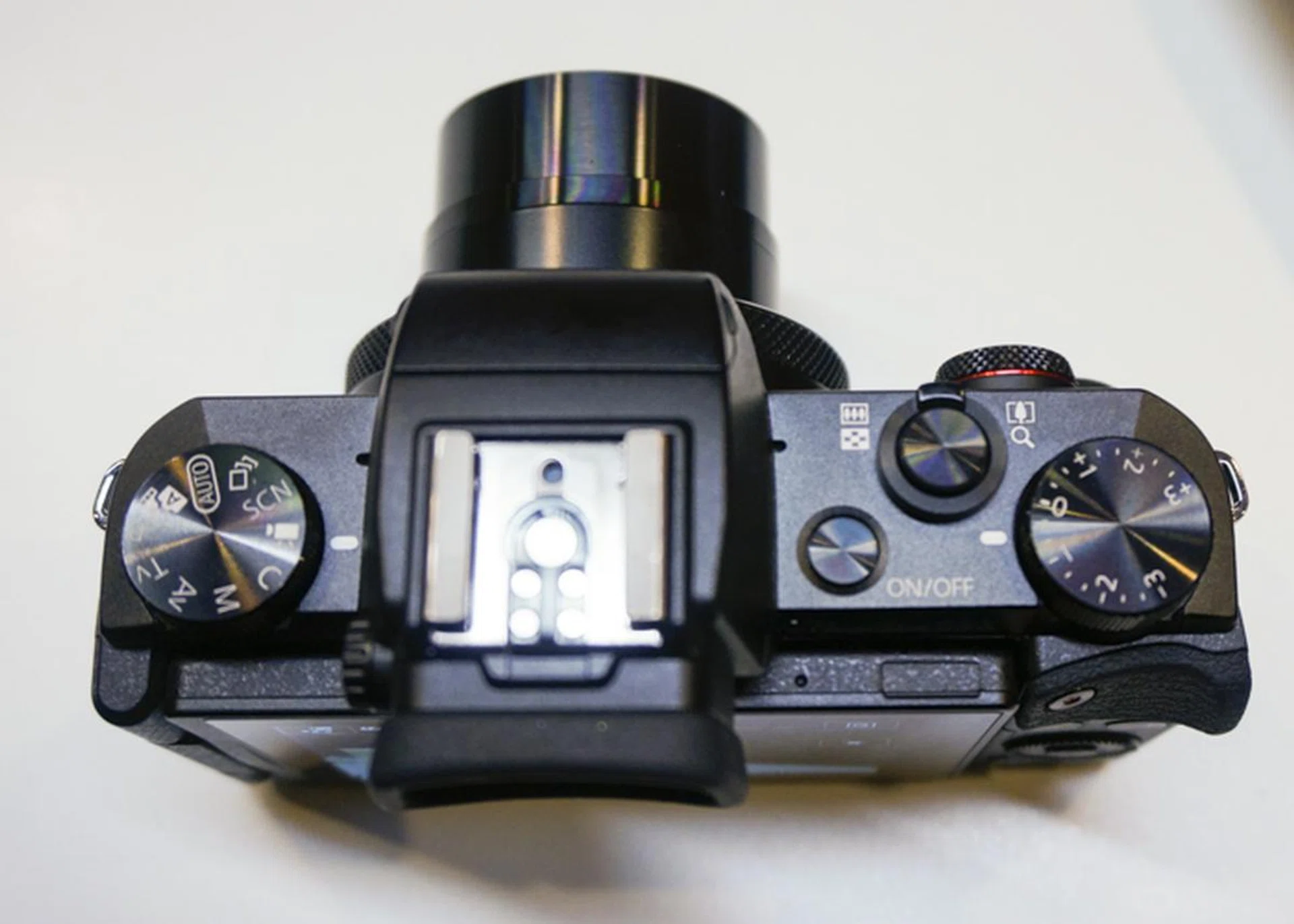The top of the camera is also very clean, with emphasis on just the mode dial and the exposure compensation dial.
