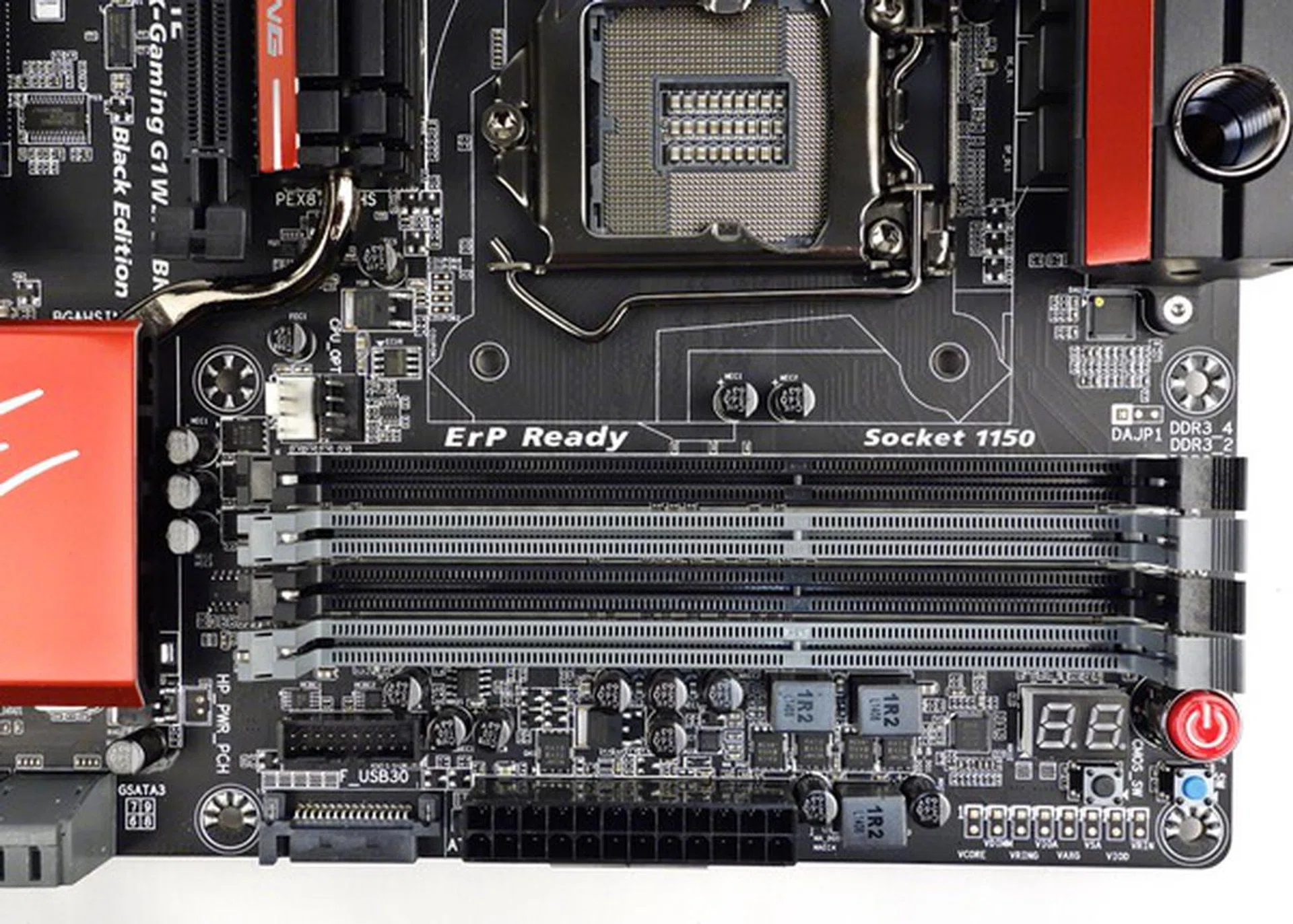 The PCIe power connector is to the left of the 24-pin ATX main power connector; while the voltage measurement points are to its right.
