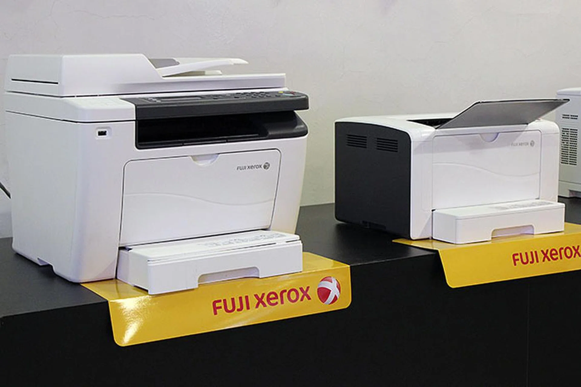 Both the P255 dw and M255 z print up to 30ppm. But for S$200 more, the M255 z is also a scanner, copier, and fax machine.