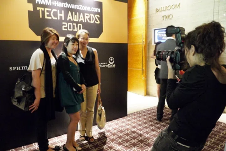 Guests taking their turn for a quick photo opportunity before being ushered into the ballroom for the grand event.