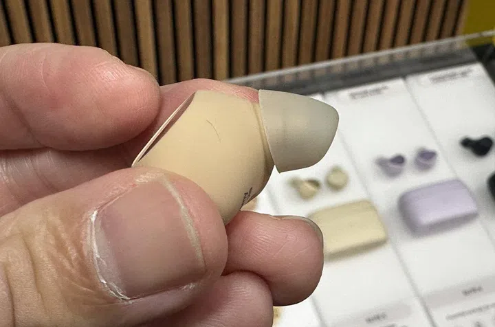 Close up of the Jabra Elite 10 and its semi-open ComfortFit design and oval EarGel. Notice that the tip step is much shorter and will not enter the ear canal.