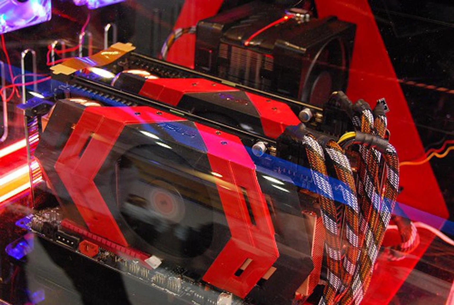 Spotted at the booth is a pair of Ares cards - "Limited Edition. Unlimited Power", or so goes the slogan. The drool-worthy Ares is made up of dual Radeon HD 5870 GPUs, 4GB of frame buffer, insane cooling with 8 heatpipes, with each 8mm thick, and a powerful fan that boasts over 600% improvement in airflow.