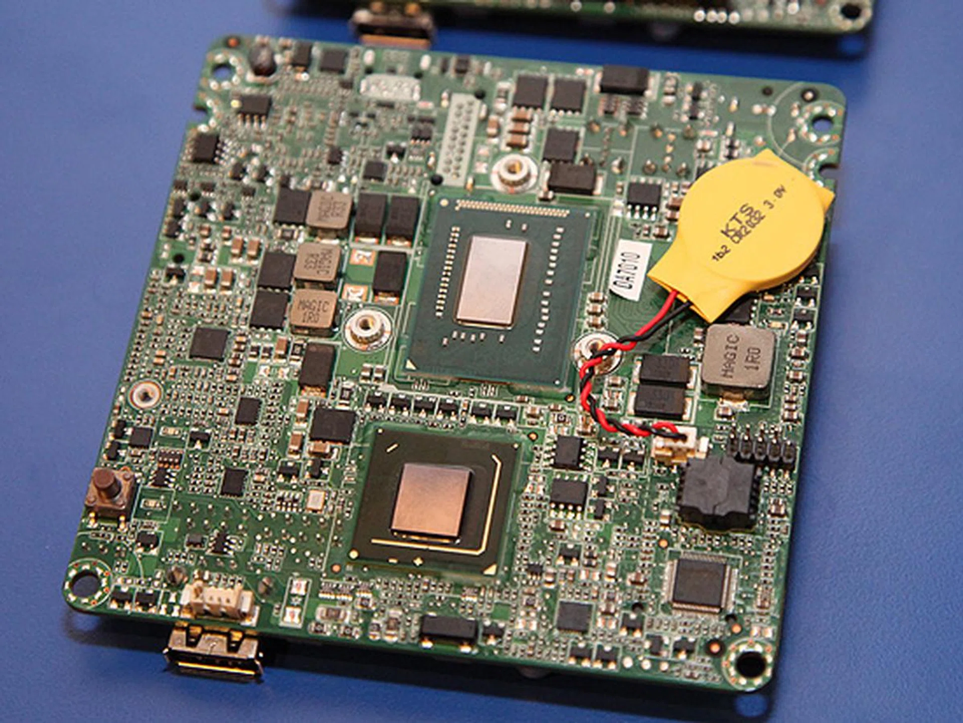 On the other side of the board, you'll find the Intel i3 Core processor and the QS77 chipset.