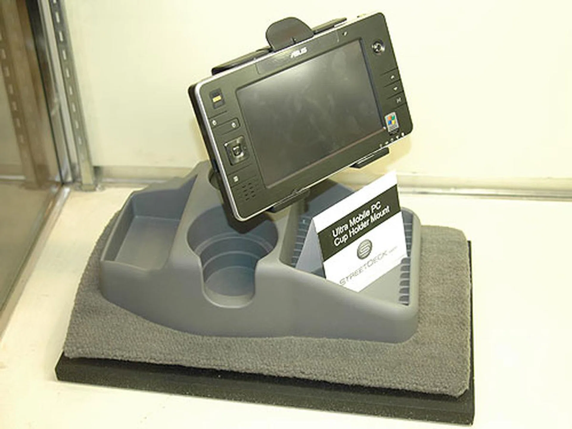 Today, you can purchase a cup holder that mounts a standard UMPC in your car.