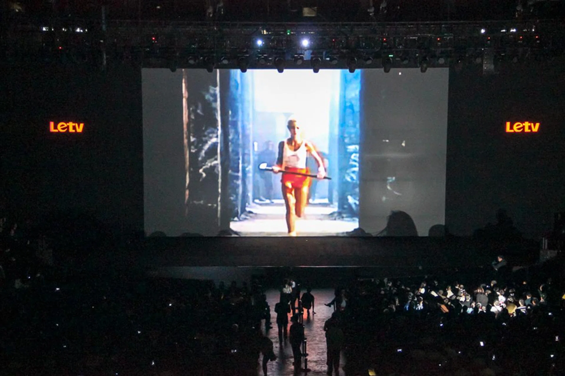 In Apple's iconic '1984' ad, a young woman runs through a crowd of mindless minions listening to a giant head on a big screen. She hurls a hammer and destroys the TV.