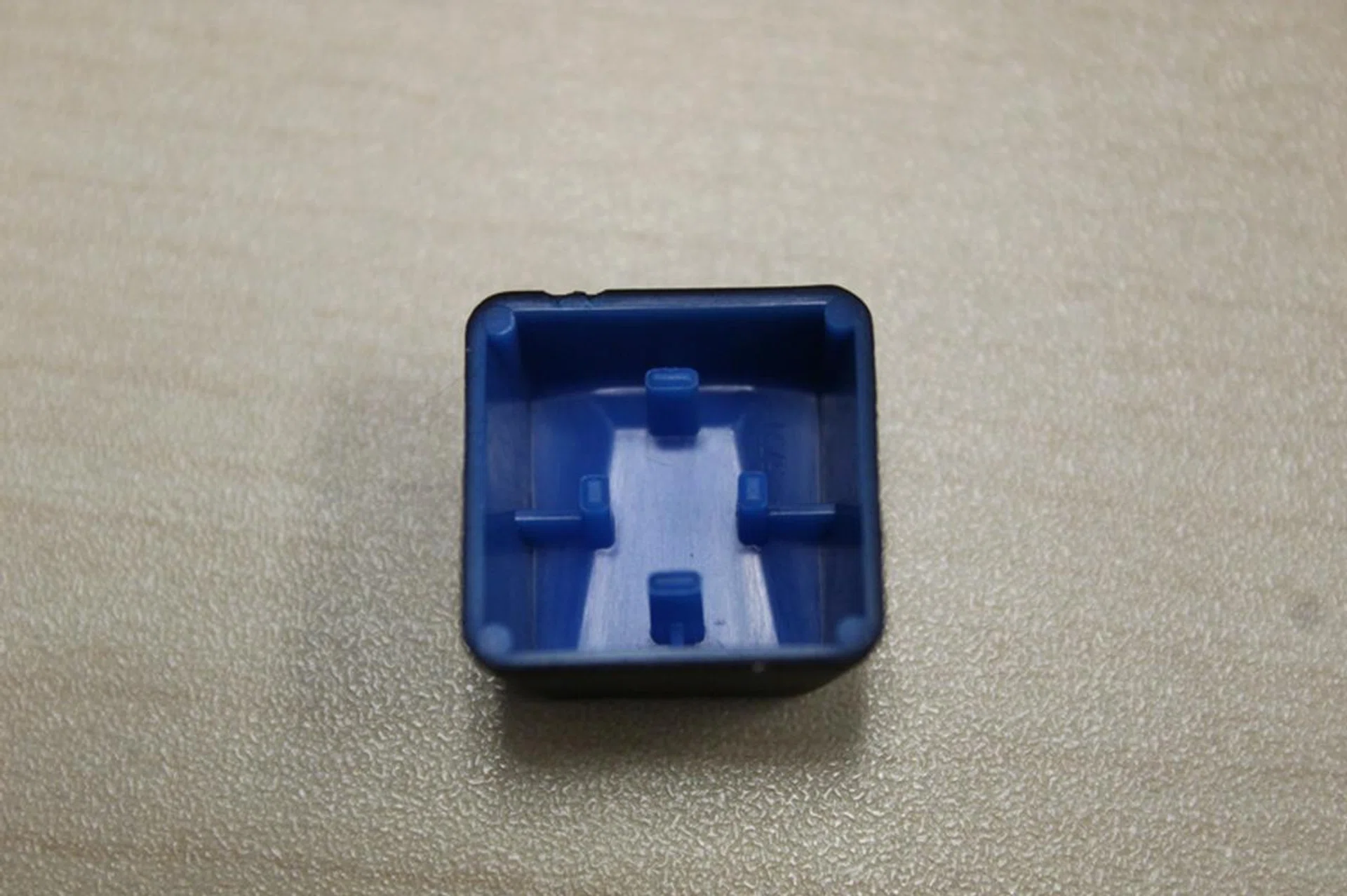 The squarish stem of the Romer-G keys mean that the keycaps are different from regular ones. Keys from Cherry or Topre keyboards have different stems from Romer-G keyboards, which makes them incompatible as well.