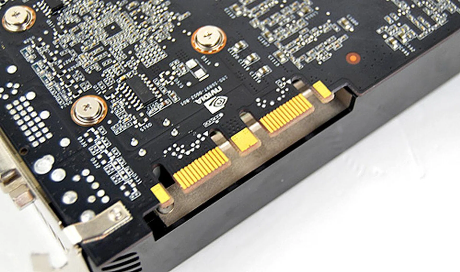 Plug in another GeForce GTX 275 and you'll have a GeForce GTX 295. Two SLI connectors also mean that 3-way SLI is a possiblity.