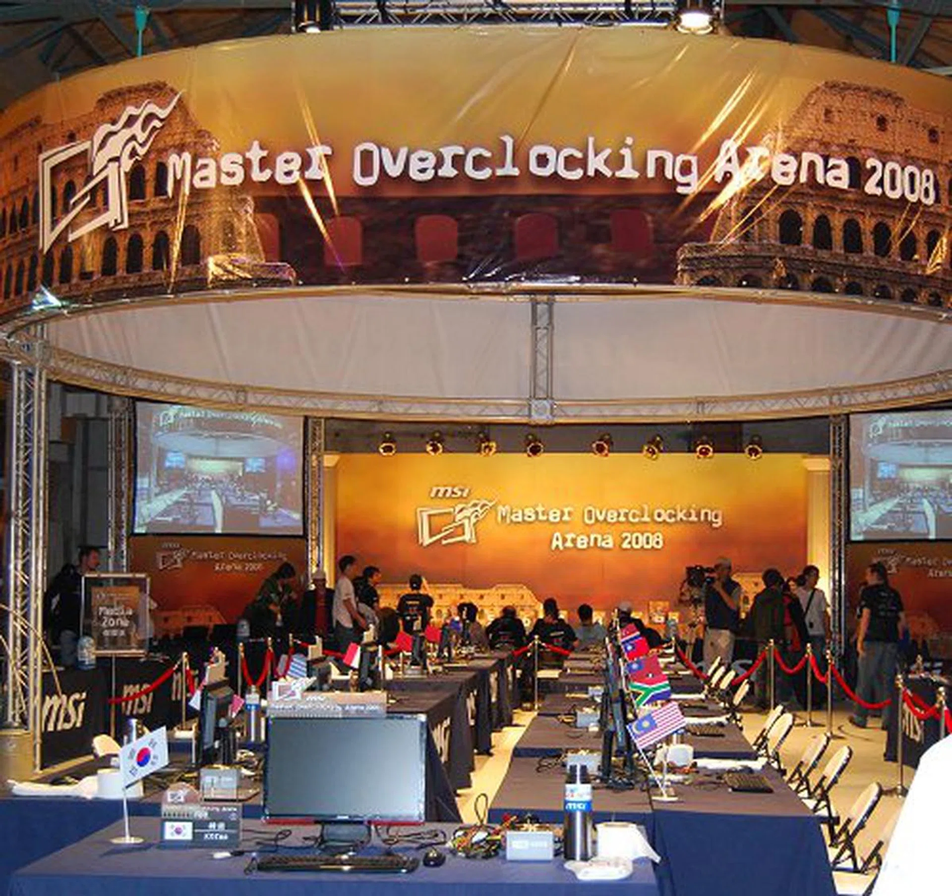  The cavernous warehouse-like arena for MSI's Master Overclocking Arena 2008. Each team of contestants is given a dedicated workbench to do their overclocking.  