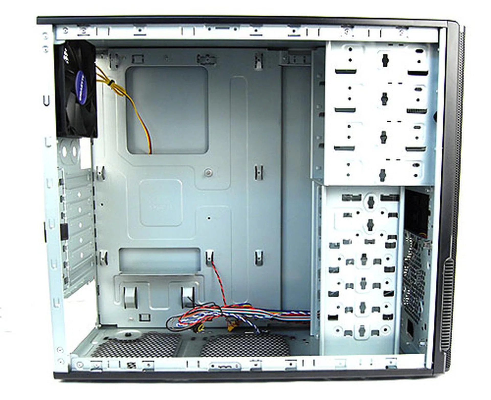Peering inside, we can see that it is sparse but spacious. We are also pleasantly surprised to find that the motherboard tray has an opening for user's to swap their CPU coolers.  We noticed also that the casing only has a single 120mm rear exhaust fan installed by default. There are other vents, but you'll have to supply your own fans.