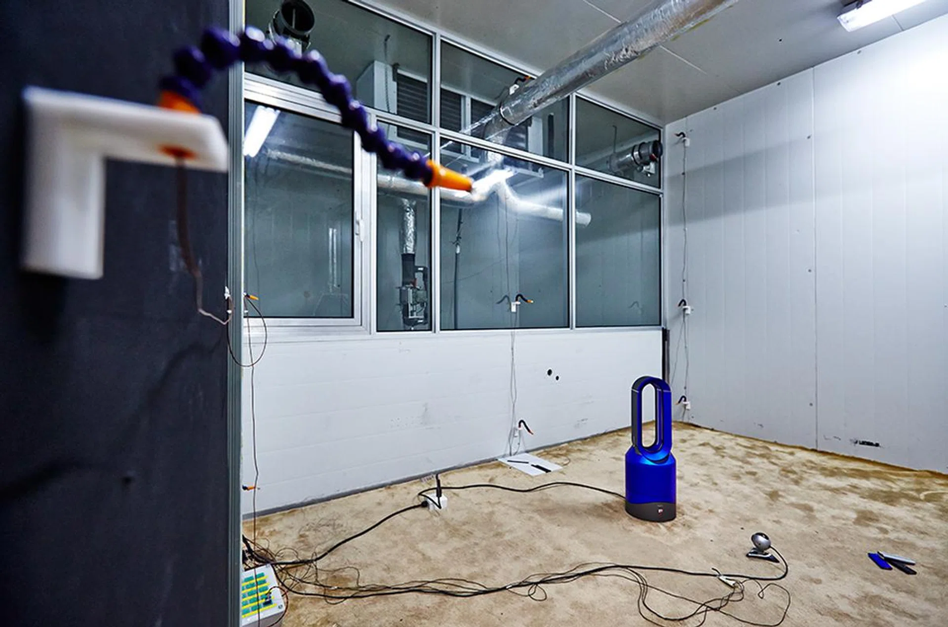 A Dyson heater is being tested in this cold room, which has been chilled to 9 degrees Celsius. Photograph by Darren Chang. Art direction by Ken Koh.