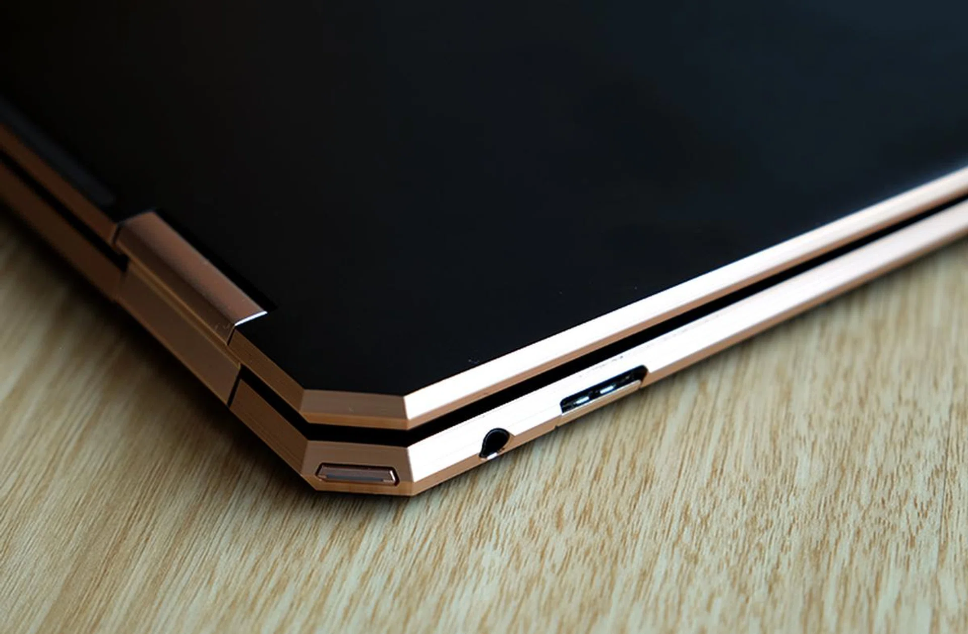 On the left, you'll find the power button in the corner, a 3.5mm audio jack, and a USB-A port.