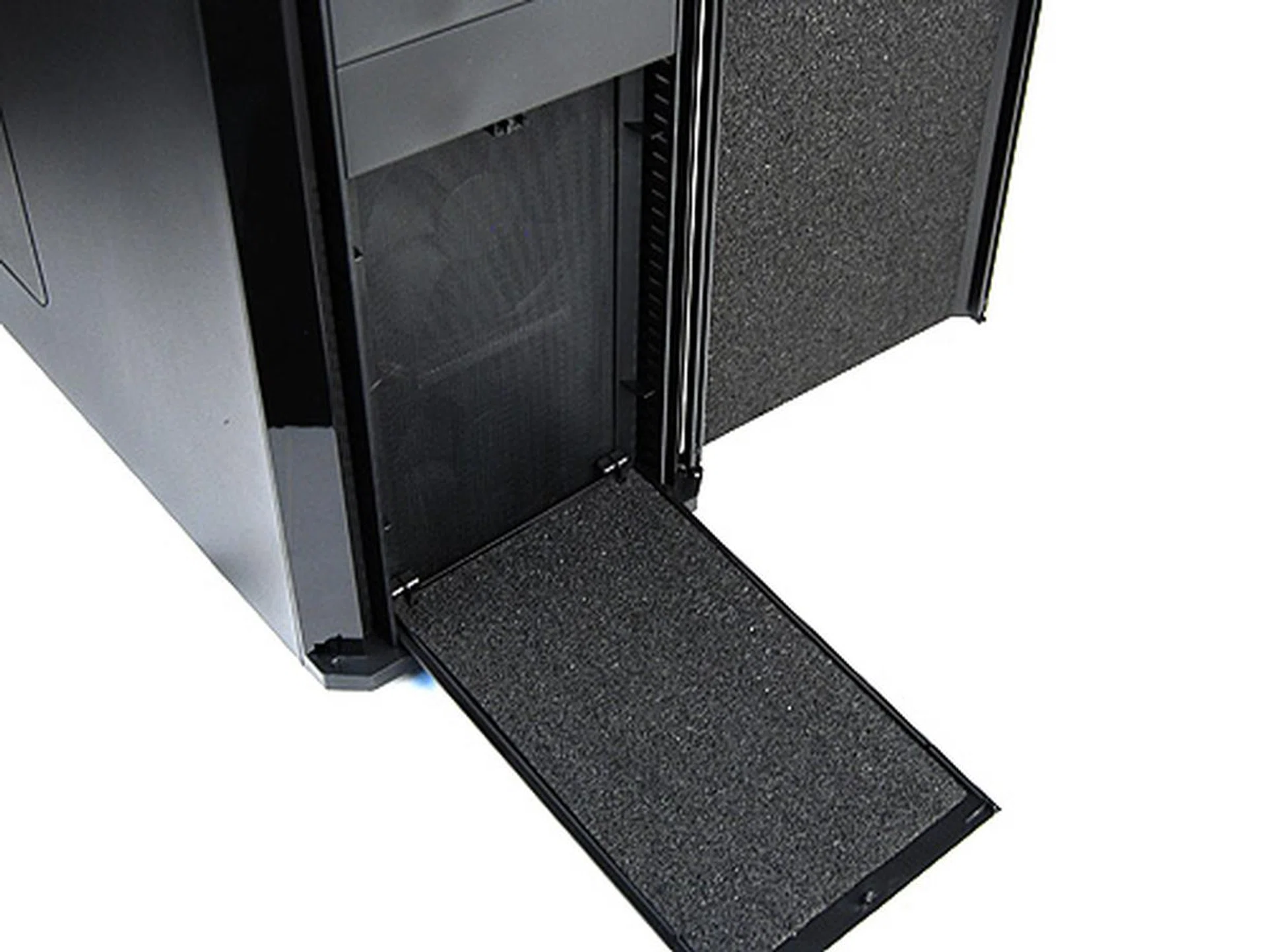 The bottom front panel can be removed to reveal more sound dampening foam. There's also a removable dust filter for the two front intake fans.