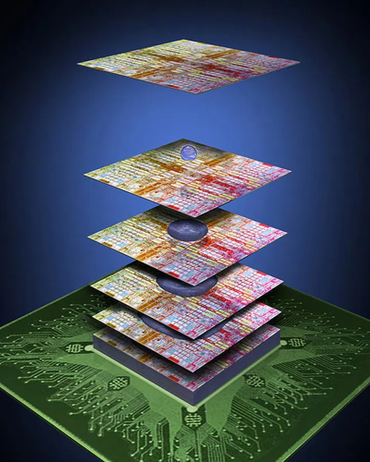 The glue, shown in blue above, connects up to 100 separate chips as it conducts heat away from the silicon package. Chips in a stacked configuration would allow for better system-on-a-chip (SoC) compatibility by combining processing, networking and memory subsystems on a single die.