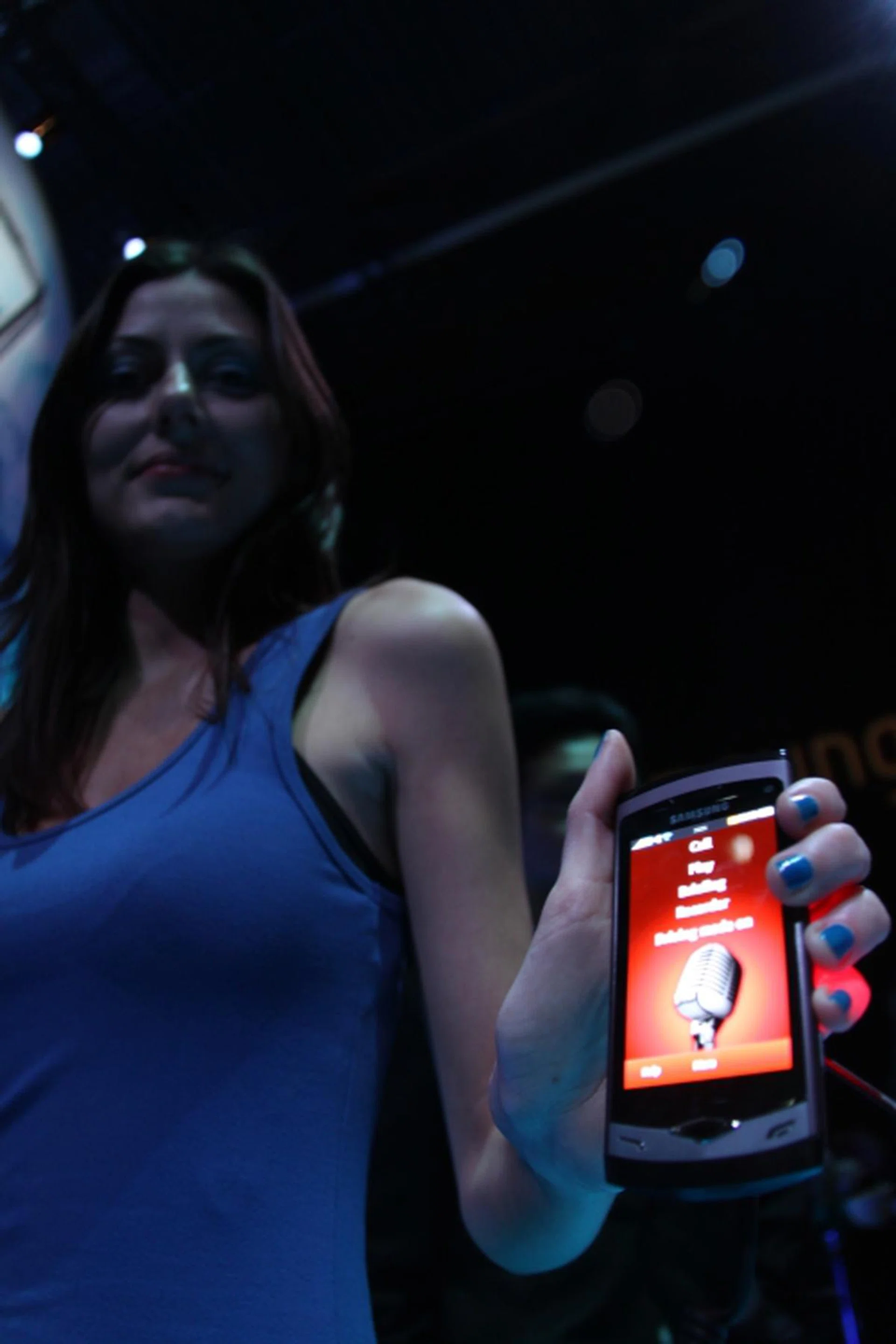 A model at the Unpacked event holding the Samsung Wave.