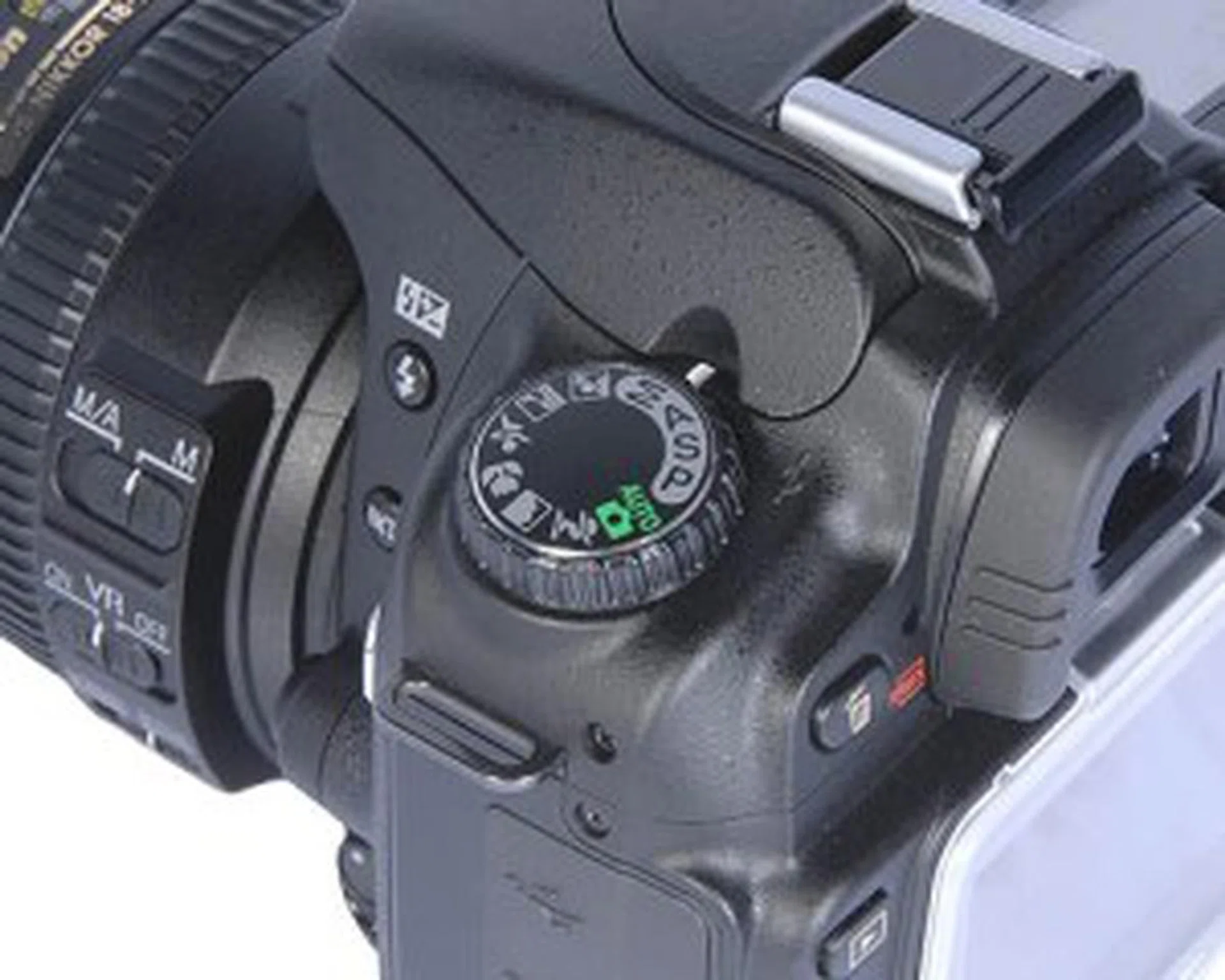 The left dial lets you adjust the exposure and scene modes.