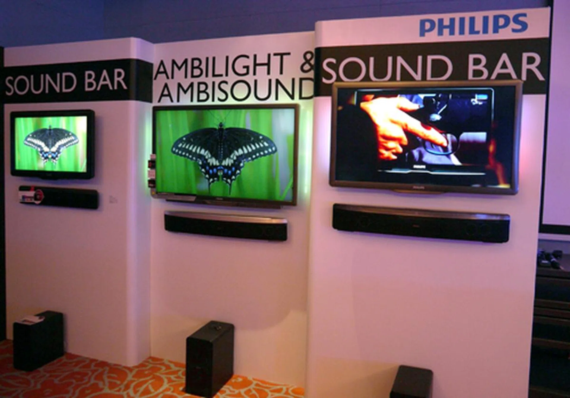Philips' upcoming 9000 series (the one in the middle) is just a mockup of the actual display. If realized, the 3D-capable screen will tout some visual treats such as a three-sided Ambilights and full LED backlights. Although nothing is cast in stone at this moment, there is a chance you might have to purchase its 3D glasses (PTA02) separately.