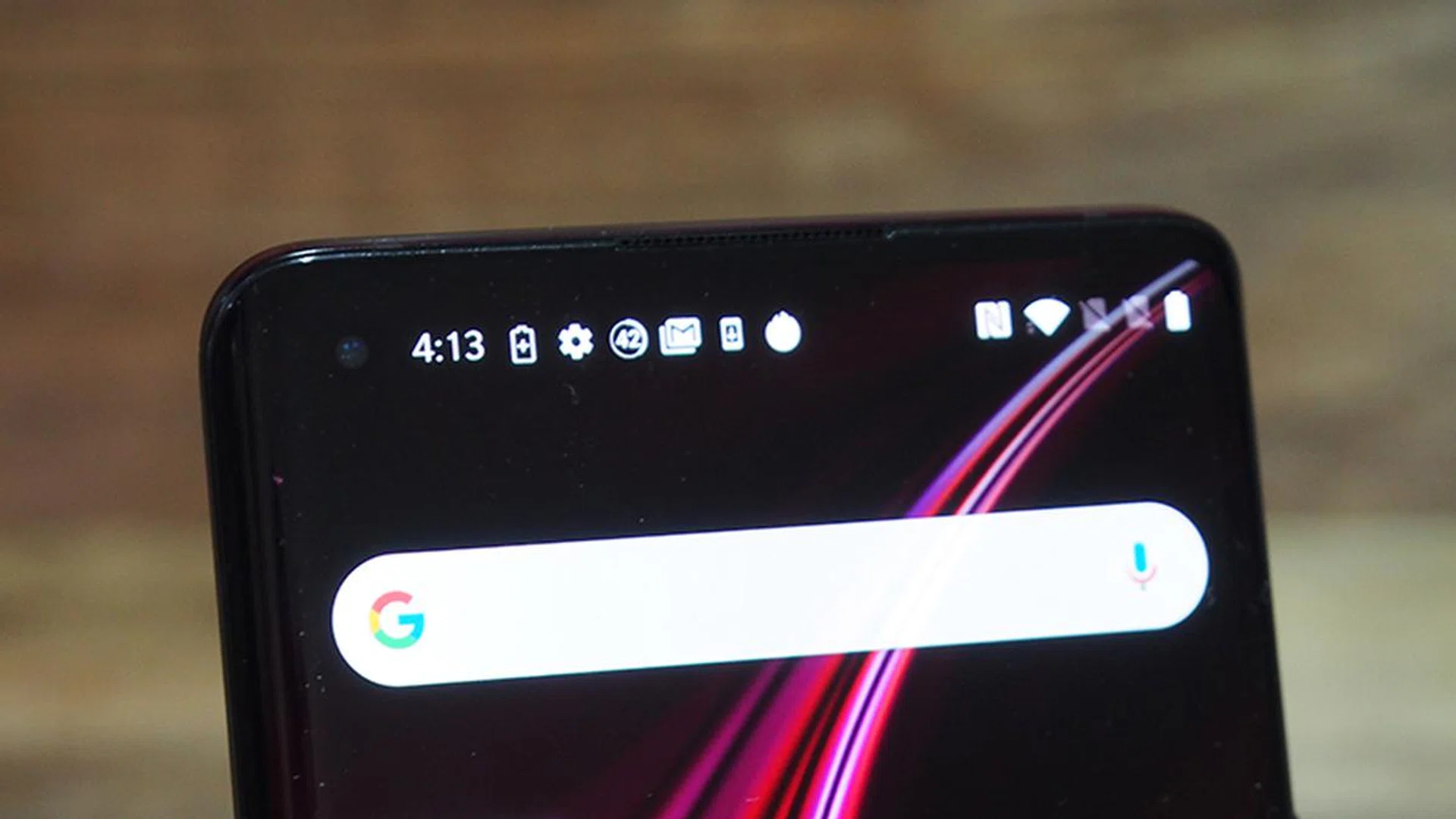 You can barely notice the hole-punch front camera in this all-black theme wallpaper on the OnePlus 8 Pro.