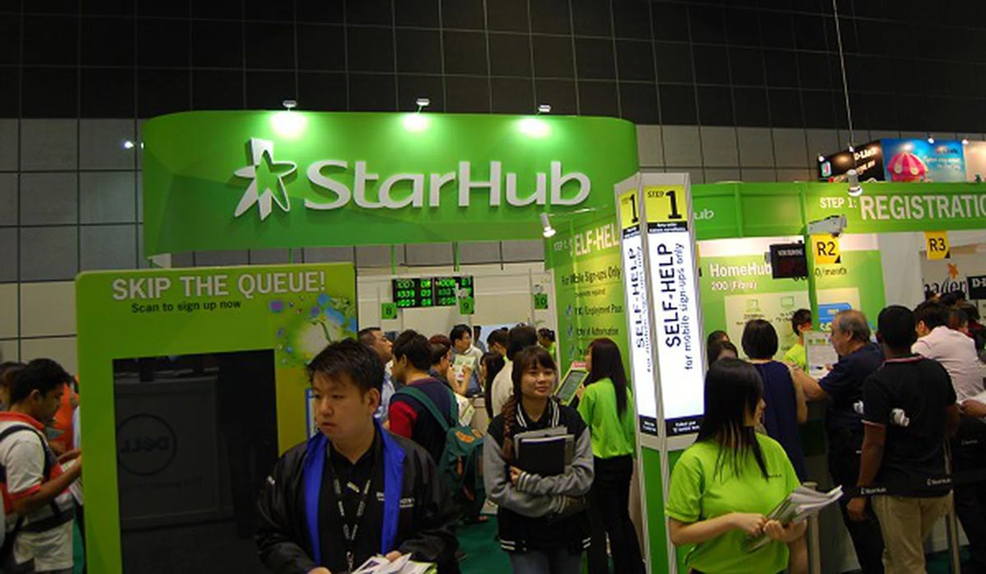 StarHub's booth is much more compact than usual, but efficiency is at work here with a new queuing system to supplement the traditional queue system.