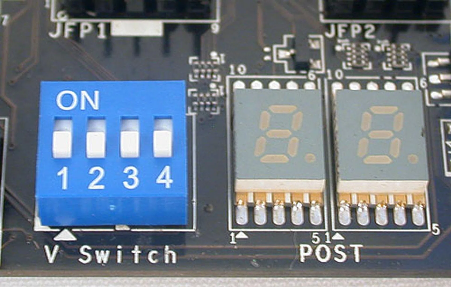 A debug LED, with the codes listed in the manual is also present while the V Switch here allows users to adjust upwards the voltage limits in the BIOS. Overclockers may choose to turn it up so that they can push the voltages and frequencies even higher.