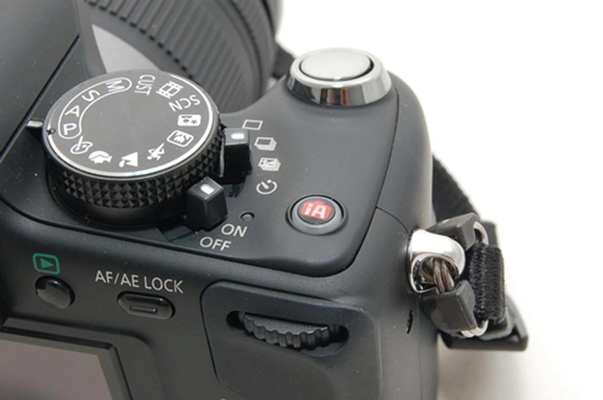 The right side of the camera might seem a little intimidating to take in at first, but rest assured that it isn't (although this is where most of the action takes place). The dial button allows users to toggle between regular shooting modes as well as scene modes. There's the usual power switch and right above it, a convenient switch for swapping from single shooting mode to timer or multiple shooting mode. The iA mode has been given its own button, allowing users to switch back and forth from manual to auto mode easily.