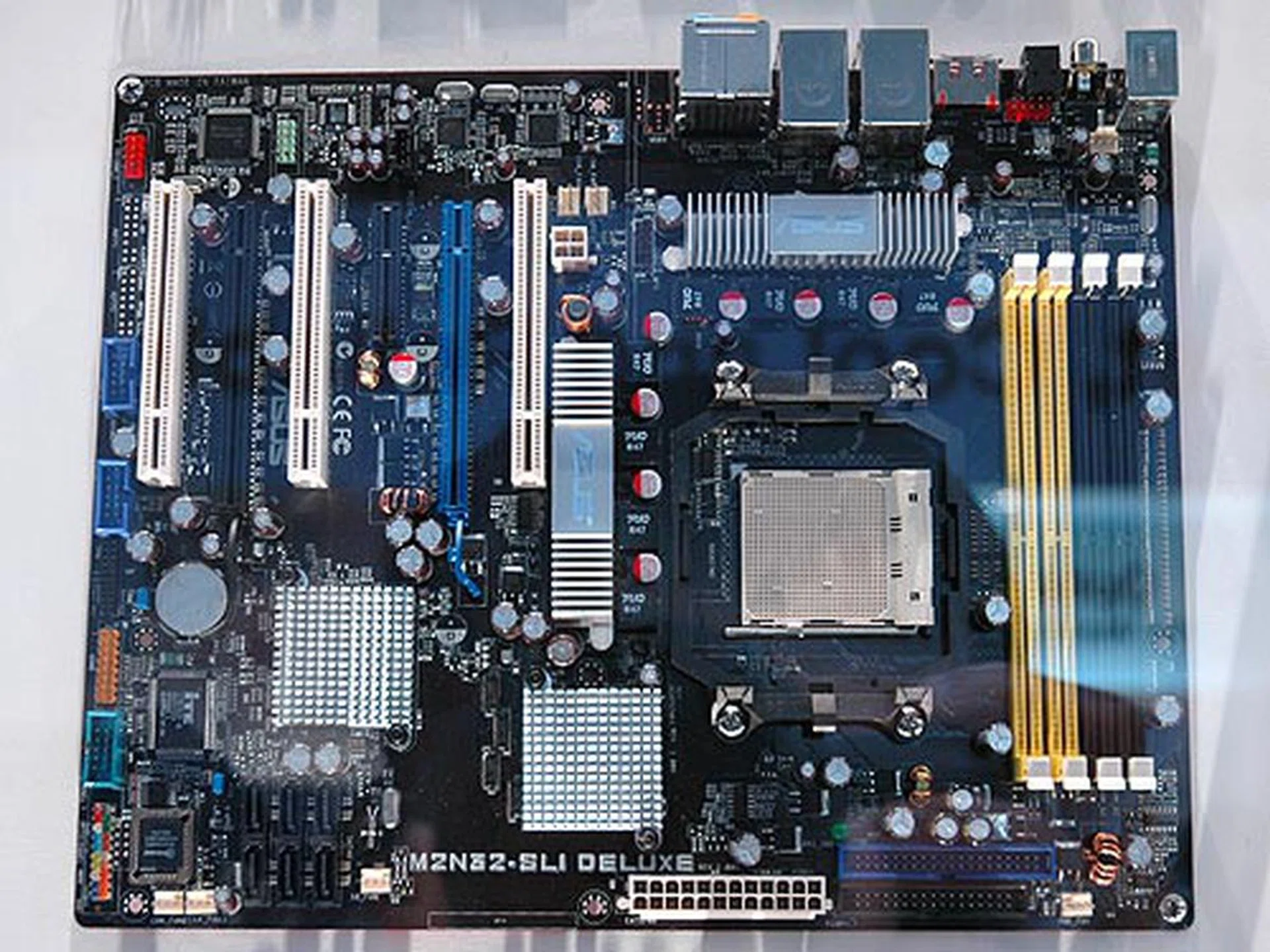 For something a little bit more powerful, ASUS offers the M2N32-SLI Deluxe which is based on the NVIDIA C51D and MCP55P chipset. It has two PCIe x16 slots for SLI graphics and it also features SATA 3G RAID, dual Gigabit Ethernet LAN, IEEE 1394a and eight-channel high definition audio.